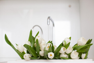  bouquet of white Tulips in a modern kitchen