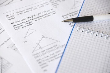 Handwriting of geometrical tasks on examination, practice, quiz or test in geometry class. Solving...