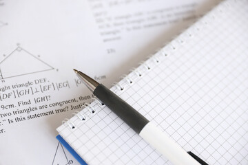 Handwriting of geometrical tasks on examination, practice, quiz or test in geometry class. Solving exponential equations concept.