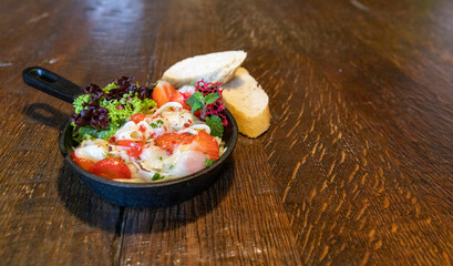 Vegetarian raw asparagus salad with strawberries in a bowl as an appetizer for menu in restaurant and cafe copy space