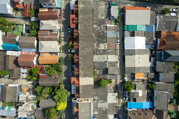 Aerial view of the roof of a house with a car taken by a drone, top view of road