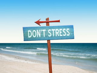Don't Stress sign for relaxation and mindfulness on nature background.