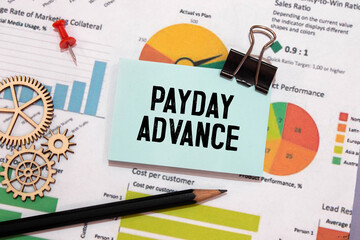 Business concept meaning PAYDAY ADVANCE with inscription on the sheet.