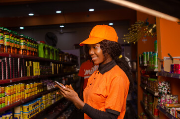 Female customer uses mobile phone in supermarket
