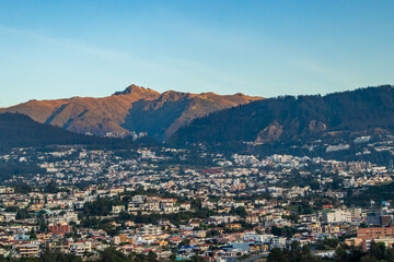 Fototapeta na wymiar View of the city of Quito and the Rucu Pichincha volcano on a summer morning.