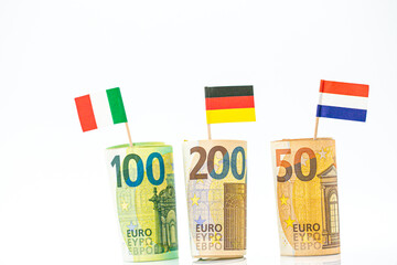 Money and flags of European countries.Flags of Germany, France and Italy euro bills on a white background.euro money 