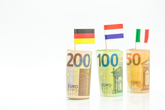 euro money inflation.Money and flags of European countries.Flags of Germany, France and Italy euro bills on a white background.Changes in the budget.Inflation and economic recession in Europe. 