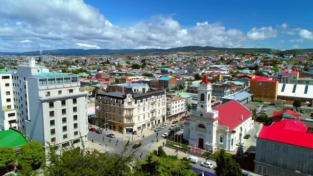 Aerial Forward Beautiful View Of Church In Town On Hills Against Cloudy Sky - Punta Arenas, Chile
