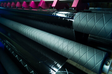 Thermal Transfer Ribbon Slitting and Rewinding Machine. Film cutting unit. A group of blades of a...