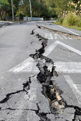 Earthquake - Huge cracks appear in city roads.