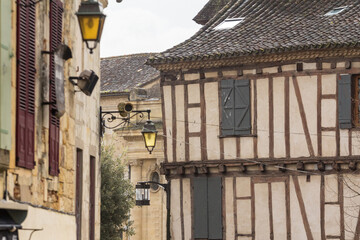 Fototapeta na wymiar Facade of half timbered houses, medieval buildings, in a typical french medieval village and city, bergerac, in France, in Dordogne and Perigord, typical of the Southwestern French architecture...