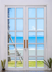 Door to a heaven with beach and sky view.