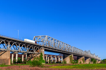  The Memphis Arkansas Memorial Bridge on Interstate 55 crossing the Mississippi River between West Memphis, Arkansas and Memphis, Tennessee..with the Frisco Bridge and Harahan Bridge in the background