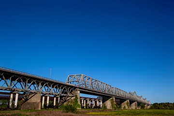  The Memphis Arkansas Memorial Bridge on Interstate 55 crossing the Mississippi River between West Memphis, Arkansas and Memphis, Tennessee..with the Frisco Bridge and Harahan Bridge in the background
