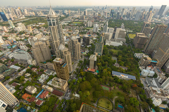 Aerial view of Ploenchit junction with cars traffic skyscraper buildings. Bangkok City in downtown at night, Thailand