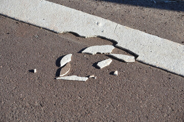 Thermoplastic bike lane markings crumbled