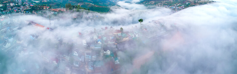 Aerial view of the town in the early morning mist is beautiful in the highlands of Da Lat, Vietnam