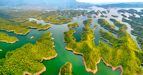 Landscape Ta Dung lake seen from above in the morning with small islands many green trees in...