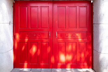 Red rectangle doors with soft bright light in street photography