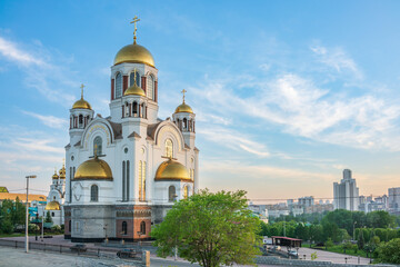 Fototapeta na wymiar Temple on Blood in spring or summer Yekaterinburg in orange sunset light. Yekaterinburg, Russia
