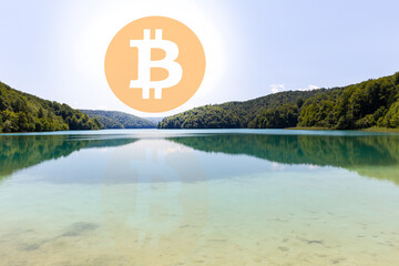 Bitcoin symbol on the lake