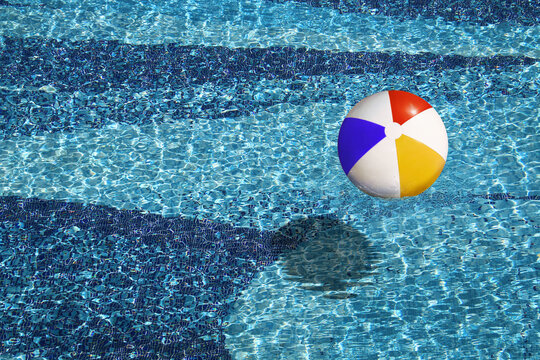 beach ball in the blue swimming pool