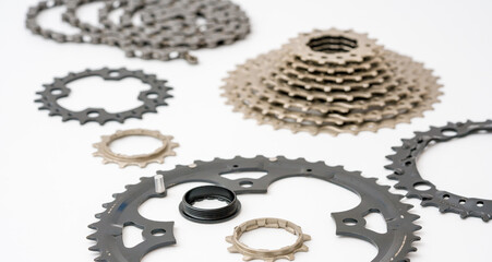 Gears, sprockets and chain of a mountain sports bike on a white background. Bicycle parts