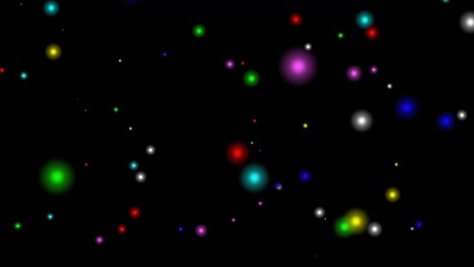 Shining colorful bokeh particles isolated on plain black background