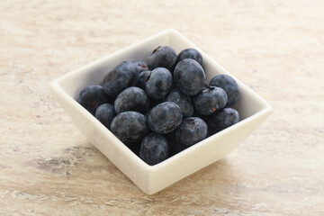 Sweet ripe blueberry heap in the bowl