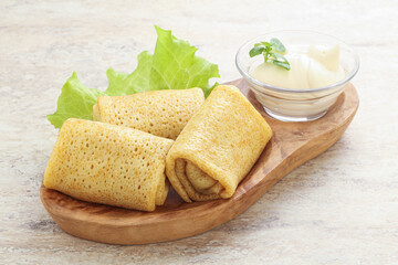 Stuffed pancakes with meat and cream