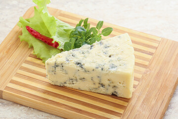 Blue cheese piece over board