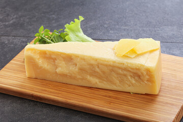 Parmesan cheese piece over board