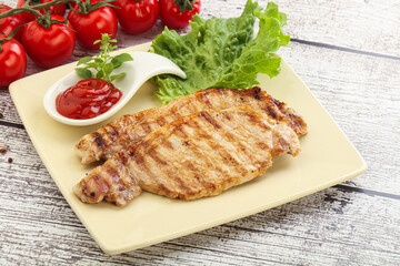 Grilled pork steak with ketchup