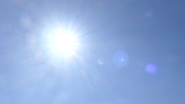 Blue Sky And Sun With Lens Flare