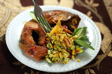Fried carp with chanachur. Indian kitchen