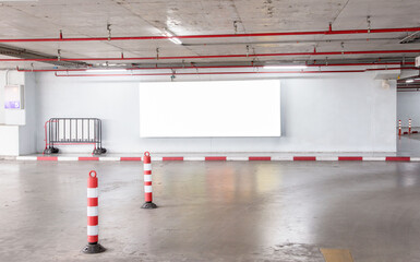 parking garage underground interior with blank billboard.Empty space car park interior at...