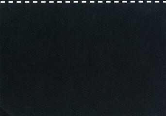 High resolution dark gray, black uncoated paper texture scan with square holes for notebook cover...