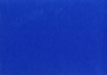High detail bright dark royal blue paper texture background uncoated rough fiber grain pattern for...