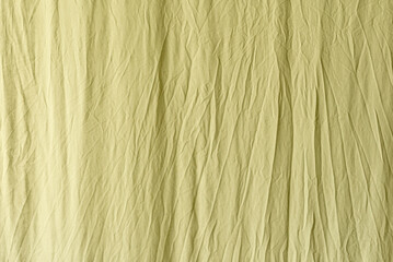 A mix of yellow and green crumpled fabric backgrounds that can be used for your text