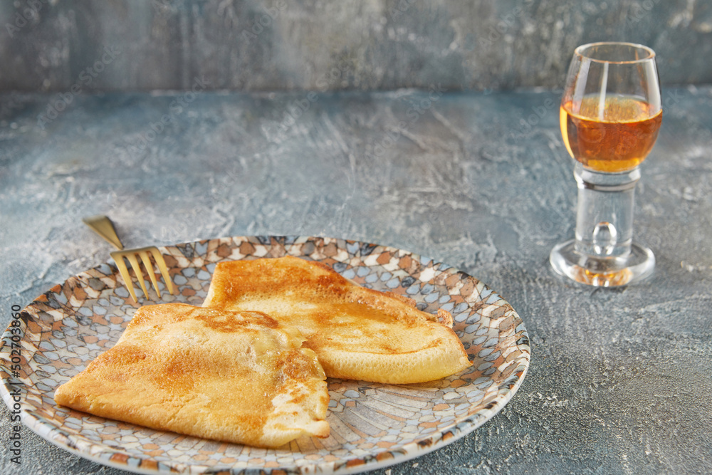 Wall mural Crepe Suzette pancakes with cognac and citrus sauce