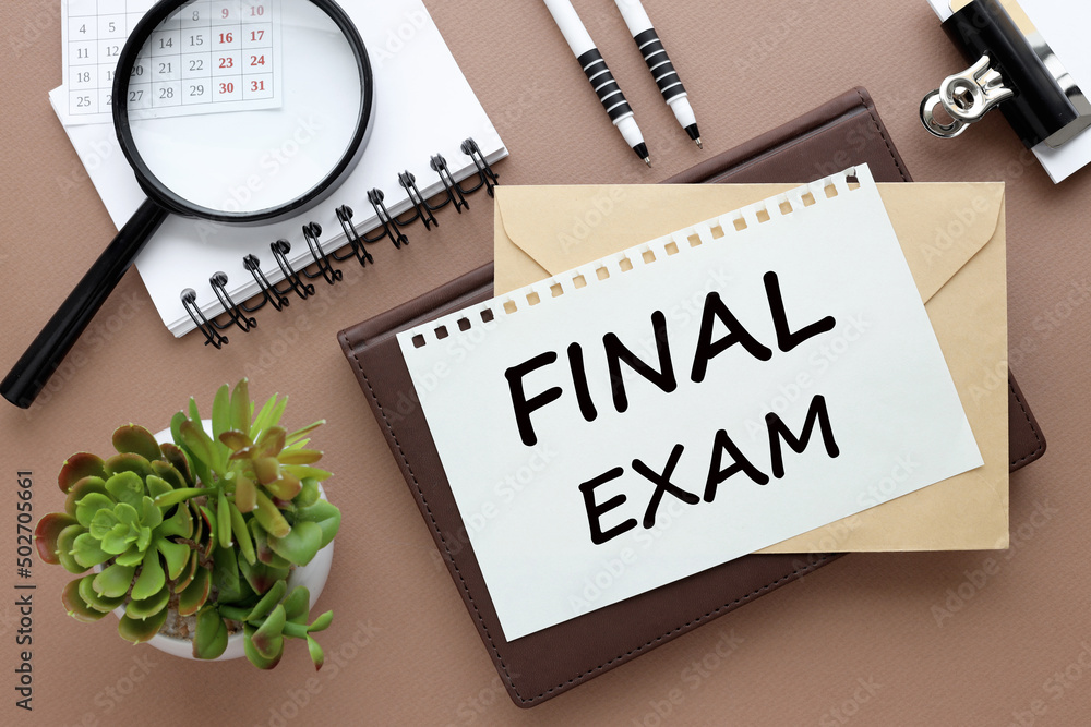 Poster final exam. text on paper on an envelope and diary on the desk