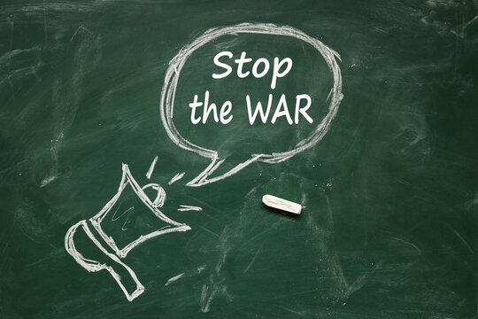 horn drawn in chalk. inscription Stop the war