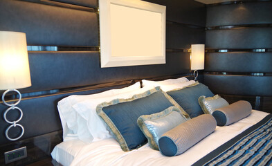 Bedroom of penthouse stateroom cabin suite in clean modern interior design onboard luxury...