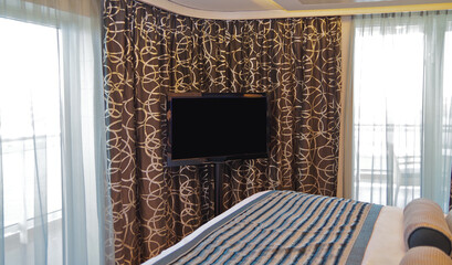 Bedroom of penthouse stateroom cabin suite in clean modern interior design onboard luxury...