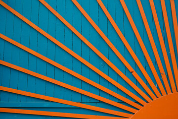 Wood sun background wooden construction old planks orange and blue fence
