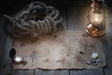 Vintage map and treasure hunting and travel accessories, table in captain's cabin, Columbus day...