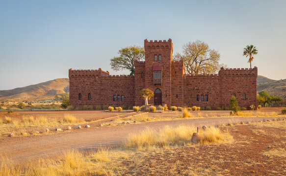 A fairytale in the wilderness: the fake medieval style castle of Duwisib built in the beginning of the twentieth century in the south of Namibia at sunrise
