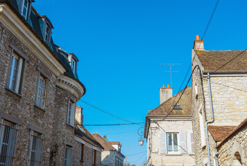 Fototapeta na wymiar Milly-la-Foret, FRANCE - April 16, 2022: Street view of Milly-la-Foret in France