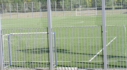 football field near fence at day sunny day