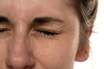 Close up image of female eye wrinkles